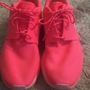 Hot pink Nike  roshe runs, size ten.
